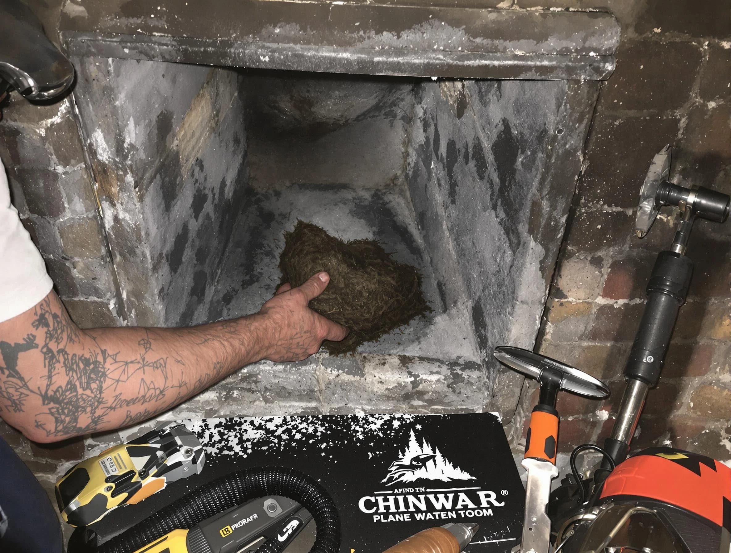 Fair Lawn Chimney Sweep safely removing debris and screening chimney in Fair Lawn, NJ